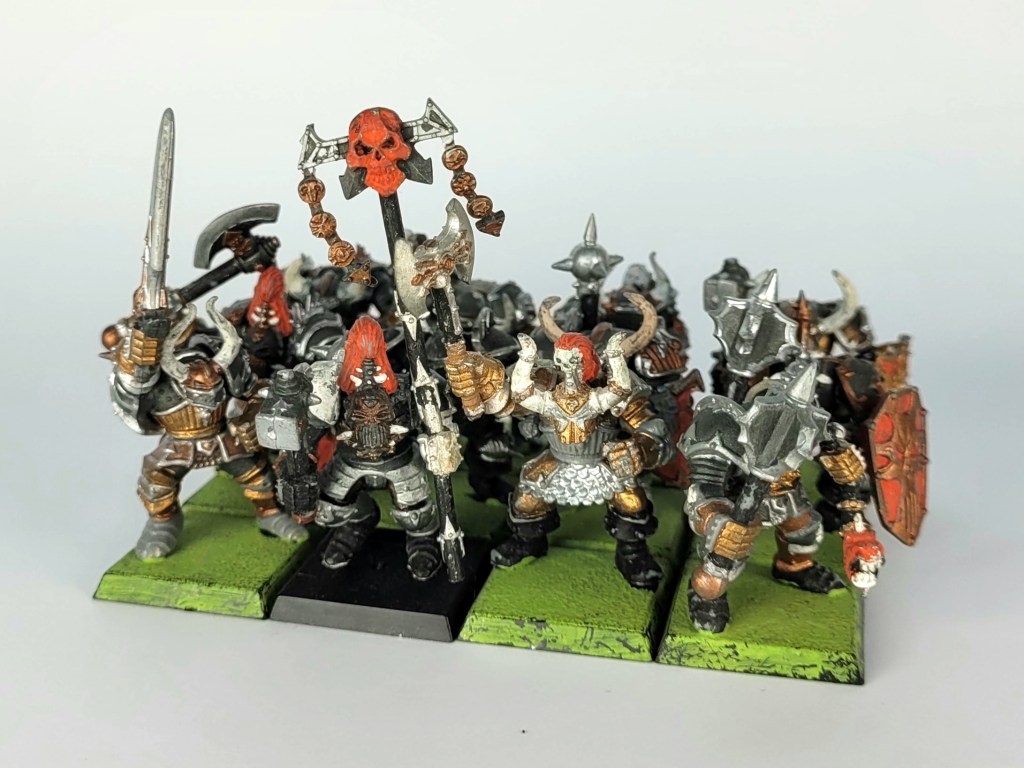 A poorly painted but complete set of multipart plastic chaos warriors